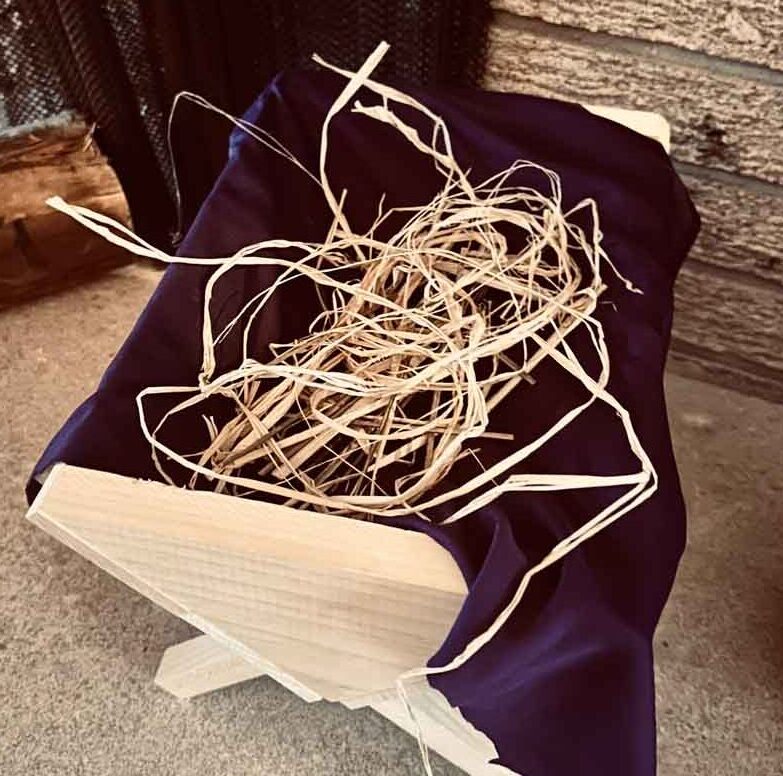 empty manger with straw